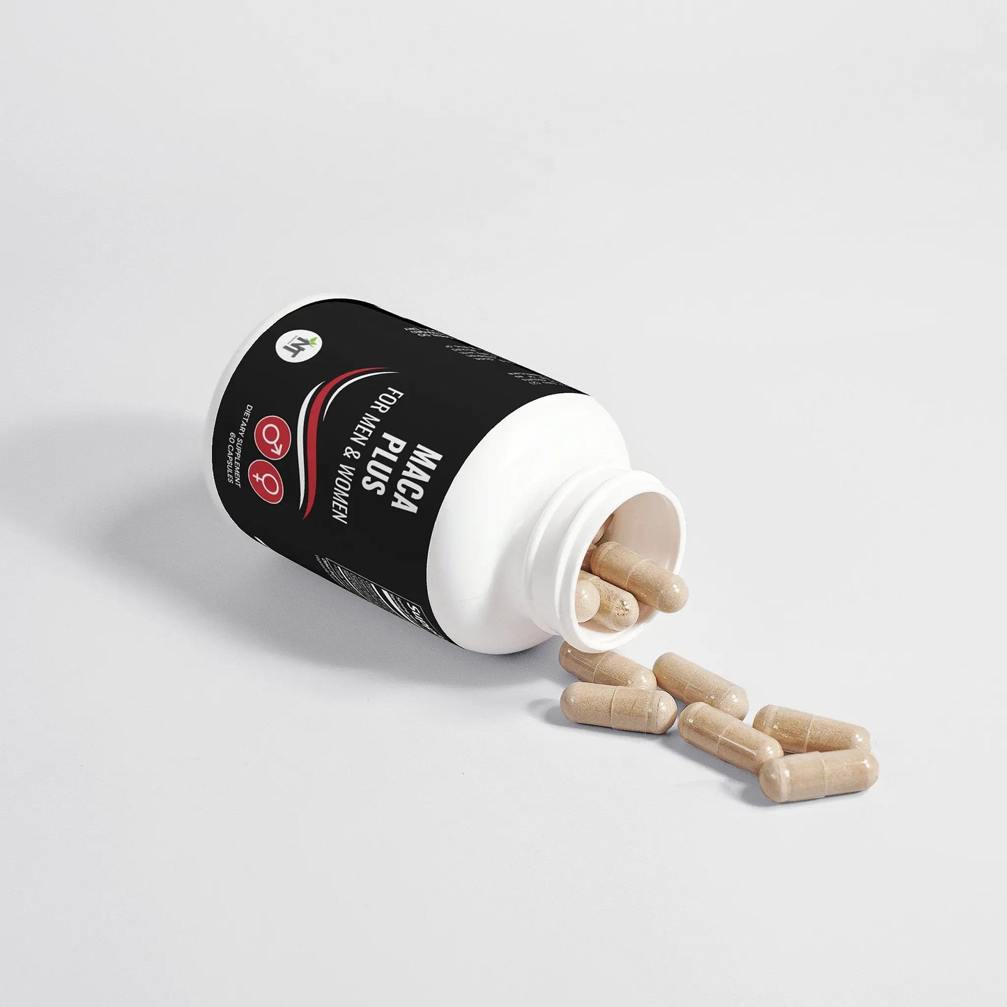 Maca Plus maca root capsules bottle tipped over with capsules spilling out – organic tri-maca supplement